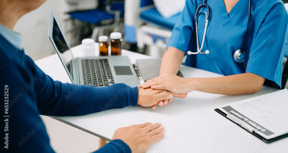 Asian female hands touching old female hand Helping hands take care of the elderly concept in hospital. Asian female hands touching old female hand Helping hands take care of the elderly concept in hospital.