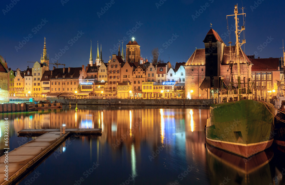 City embankment and facades of medieval houses in the Old Town at night, Gdansk,Poland.