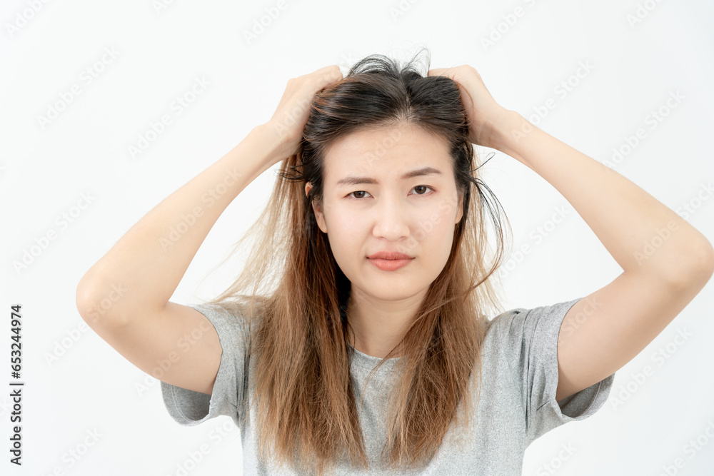 Asian woman very sad and upset looking at damaged hair, hair loss, hair thinning problem, vitamin deficiency, baldness, postpartum, biotin, zinc, menstrual or endocrine disorders, hormonal imbalance