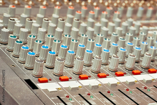 Mixing console for controlling the volume, frequencies of musical instruments