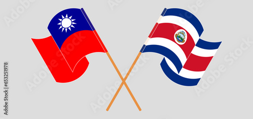 Crossed and waving flags of Taiwan and Costa Rica