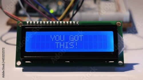 A close up of an LCD display starting up from blank, to then displaying the positive affirmation 'You Got This!' photo