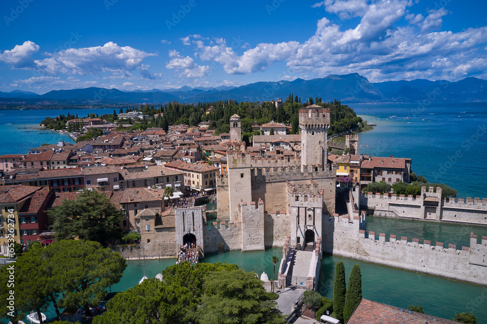 Panoramic view of Lake Garda. Sirmione, an ancient village on southern Garda Lake. Aerial view to the town of Sirmione, popular travel destination on Lake Garda in Italy. View of the city of Sirmione
