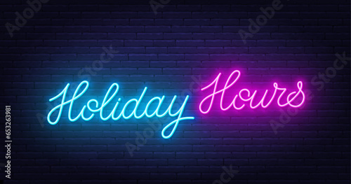 Holiday Hours neon lettering on brick wall background.