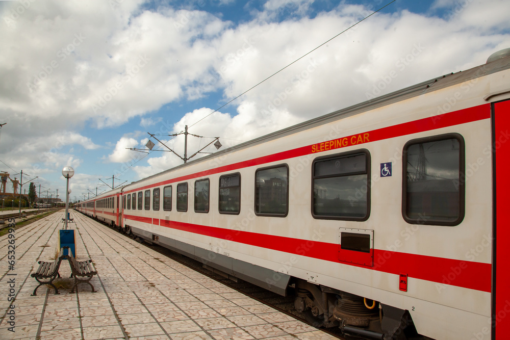 Platform with bench and train at the train station