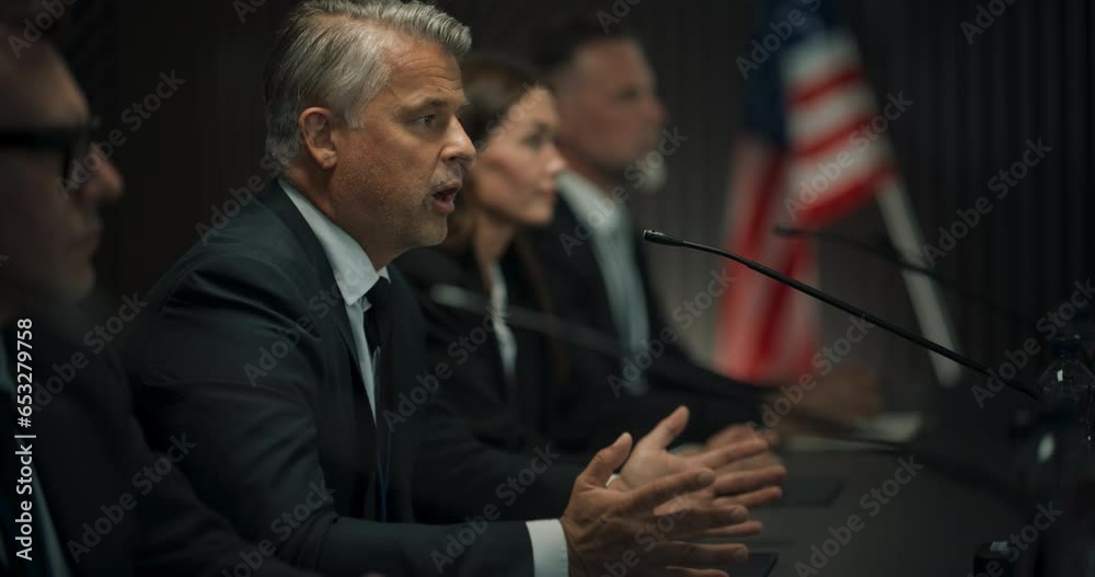 Zoom Out Shot Of Caucasian Male Organization Representative Speaking at Economic Conference. Head Of USA Delegation Delivering Speech at International Political Summit. Diverse Delegates Listening.