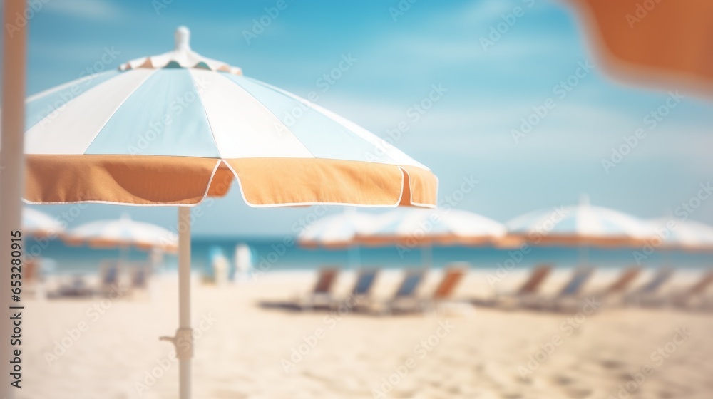 Fototapeta premium sunny beach with parasols with blurred background