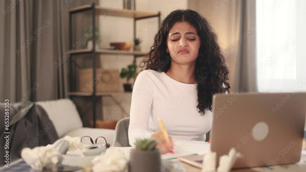 Sad young woman student or freelancer with lack of new ideas or creative block writing and crossed out at home Worried curly female with crumpled papers with failed ideas working or studying indoors Sad young woman student or freelancer with lack of new ideas or creative block writing and crossed out at home Worried curly female with crumpled papers with failed ideas working or studying indoors