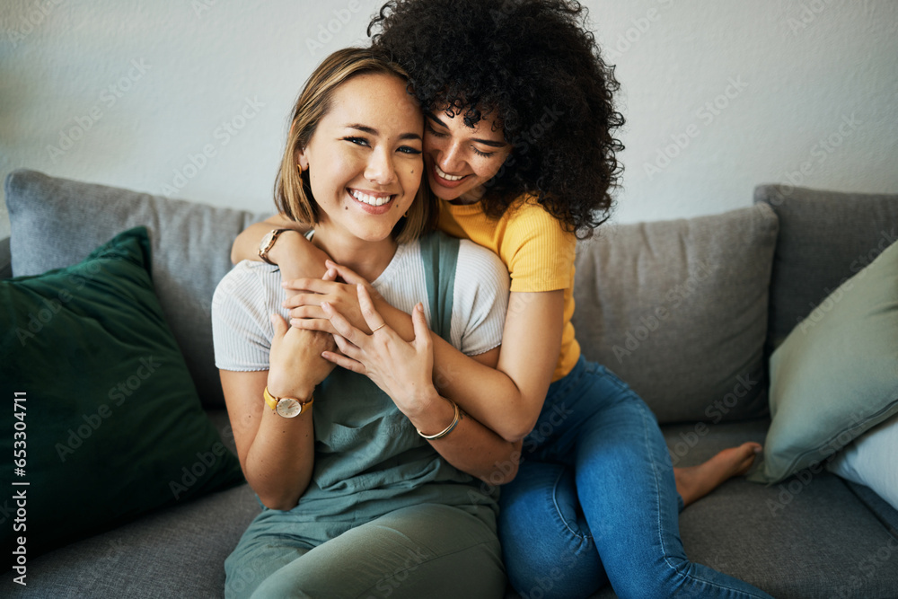 Lgbt, couple and portrait of hug on sofa in home, living room or apartment with love, support and happiness. Lesbian, women and embrace together with smile on face on lounge couch in new house Lgbt, couple and portrait of hug on sofa in home, living room or apartment with love, support and happiness. Lesbian, women and embrace together with smile on face on lounge couch in new house
