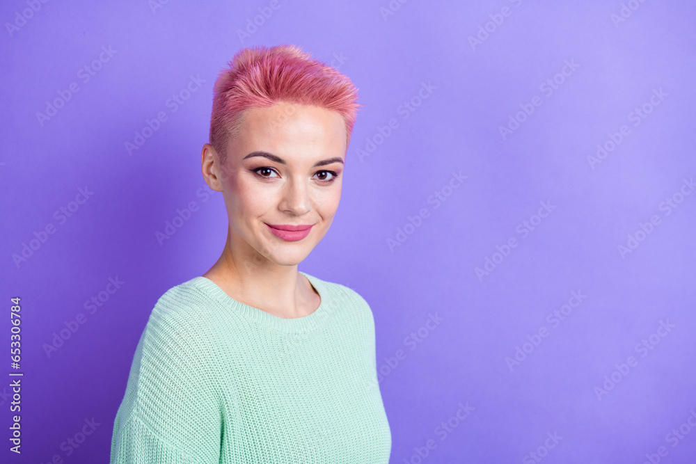 Photo of cheerful pretty girl wear turquoise sweater smiling empty space isolated violet color background Photo of cheerful pretty girl wear turquoise sweater smiling empty space isolated violet color background