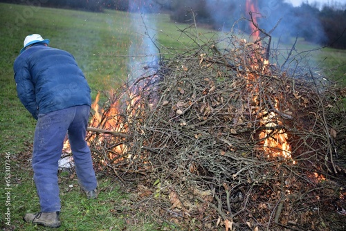 Burning of waste branch in the garden autumn tradition