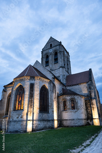 Church of Notre-Dame-de-l'Assomption, a Catholic parish church located in Auvers-sur-Oise, in the French department of Val-d'Oise, France. The church was painted by Vincent van Gogh. Sunset, blue sky