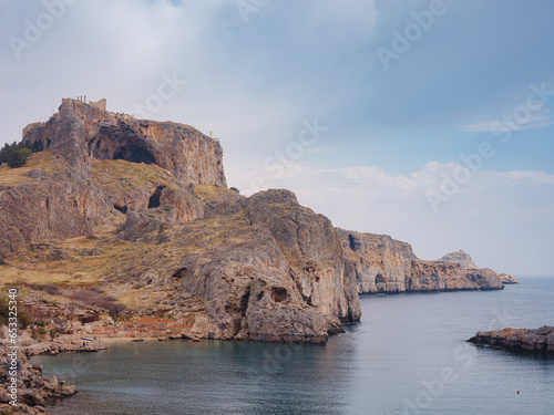 Rhodes, Greece. Lindos small whitewashed village and the Acropolis, scenery of Rhodos Island at Aegean Sea. St. Pauls bay