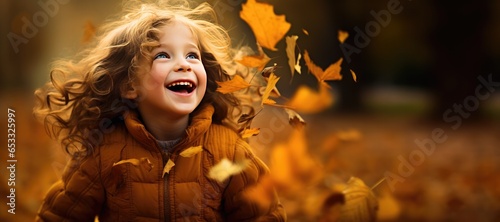 Happy Young Girl Playing in...