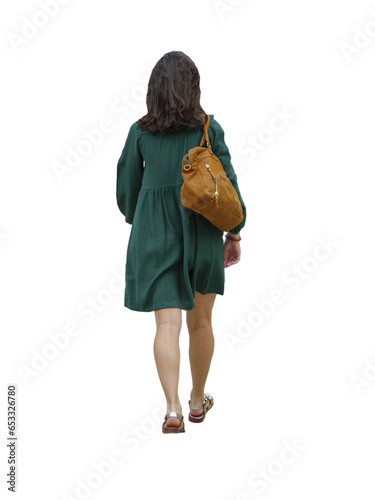 jeune femme  vue de dos en promenade en été, Elle porte une robe verte et un sac à main photo