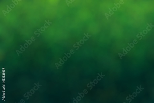 Green wallpaper, bokeh style. Colour transition from light green to dark green. Blurred patches in different shades of green.