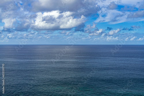 Atlantic ocean evening view   with horizon and white clouds background  Tenerife  Canary islands  Spain