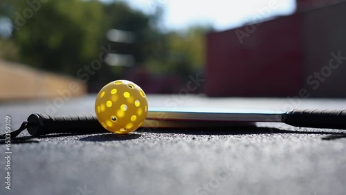 Pickleball spinning on the court