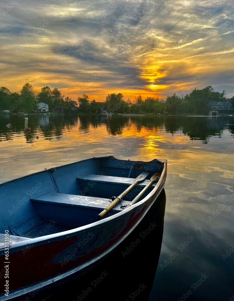 Rowboat on tranquil lake at Sunset Rowboat on tranquil lake at Sunset