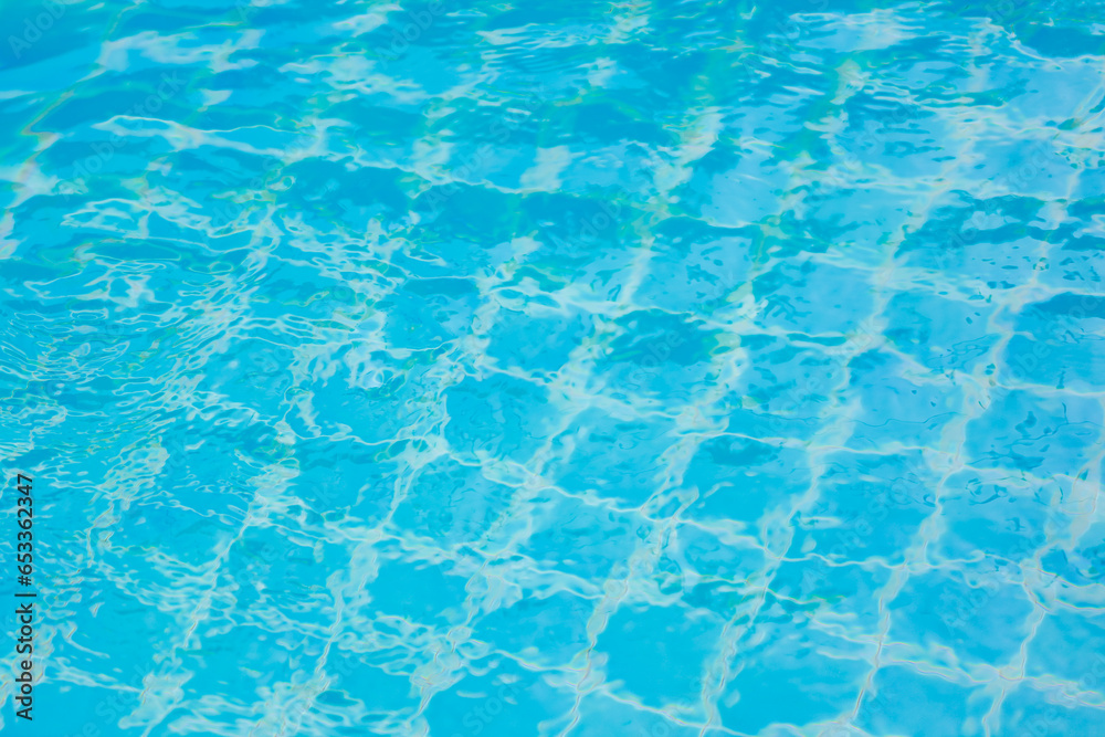 Water in swimming pool rippled water detail background.