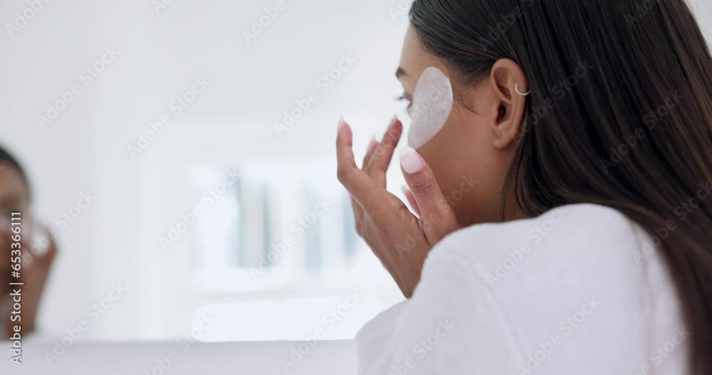 Bathroom, mirror and woman doing morning skincare or beauty routine or cosmetic treatment as self care in a home. Dermatology, facial and person doing cleanse, detox and cleaning face with product Bathroom, mirror and woman doing morning skincare or beauty routine or cosmetic treatment as self care in a home. Dermatology, facial and person doing cleanse, detox and cleaning face with product