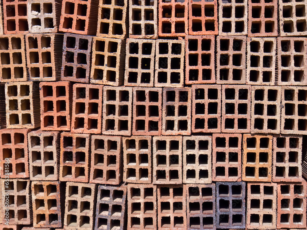 A stack of hollow clay blocks in a construction site, in a farm in the eastern Andean mountains of central Colombia. A stack of hollow clay blocks in a construction site, in a farm in the eastern Andean mountains of central Colombia.