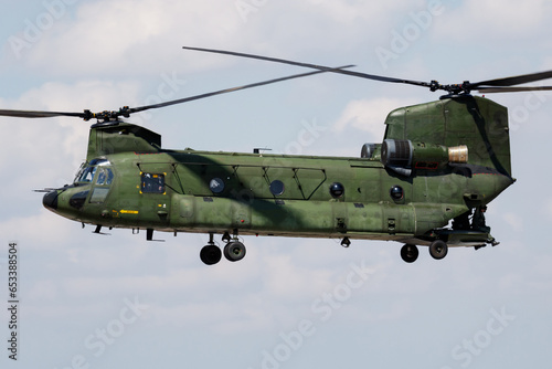 Untitled military helicopter at air base. Air force and army flight transportation. Aviation and rotorcraft. Transport and airlift. Military industry. Fly and flying.