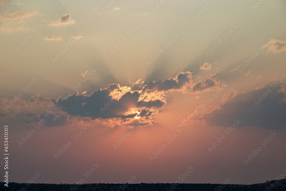 Sunset over the Kalahari. Light play in the clouds.
