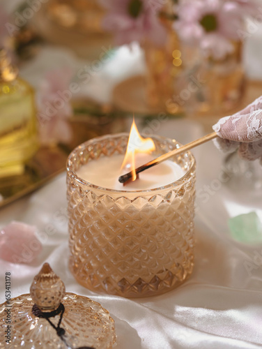 Vegan handmade candle with rose quartz. Soy, coconut candle with wooden wick. Aesthetic interior, eco home decoration. Selective focus