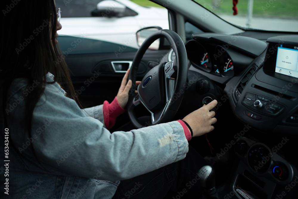 Young Girl Learning to Drive, Starting the Car with Keys