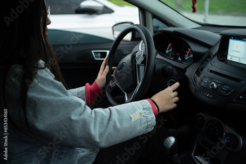 Young Girl Learning to Drive, Starting the Car with Keys © LVSN