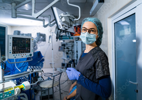 Portrait of surgery specialist in sterile mask. Professional operation assistant. photo