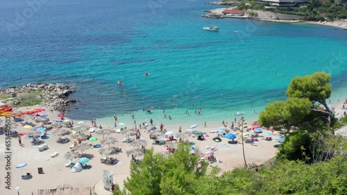 Best swimming beach in Croatia. Bay with turquoise clear water and people