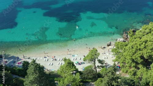 Beautiful beach in Croatia. Drone tilt view from above. people swimming photo