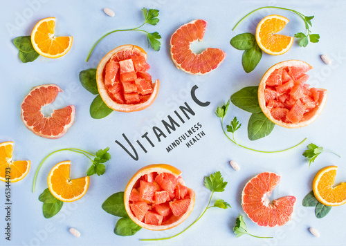 Collection of vitamin C sources. Fruits enriched with ascorbic acid: orange, grapefruit, spinach, parsley Dietetic food, organic nutrition composition. Flat lay. Top view. 