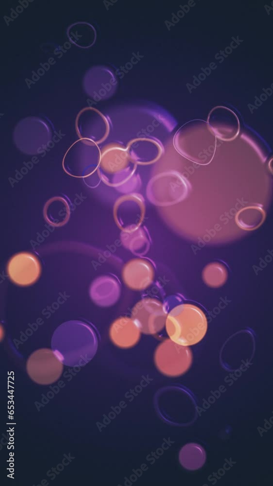 Vertical video - abstract bokeh particles background with orange and purple plastic spheres and ring squiggles. This trendy liquid motion style background animation is full HD and a seamless loop.