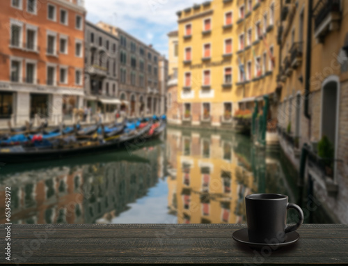 Black Coffee Cup on Blurred Beautiful View Background