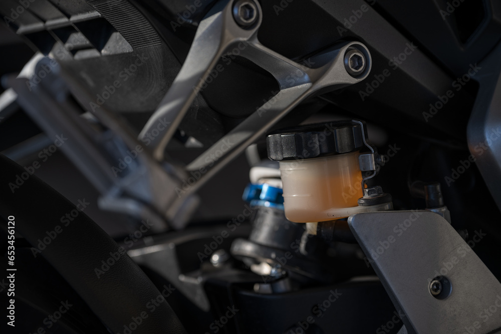Motorcycle brake reservoir with fluid.