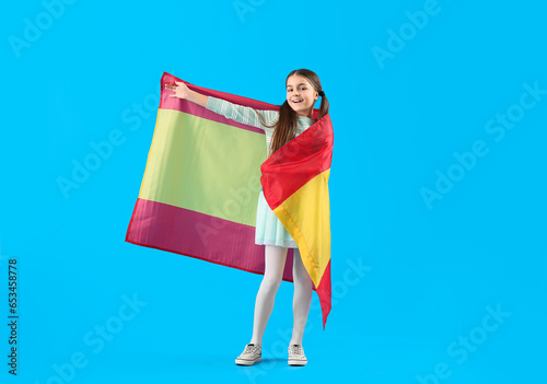 Little girl with flag of Sp...