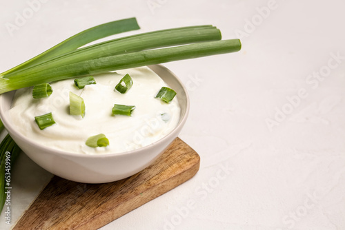 Bowl of tasty sour cream wi...