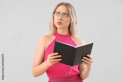 Thoughtful young woman in s...