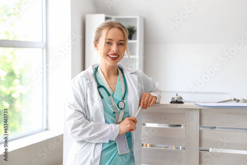 Female doctor at reception ...