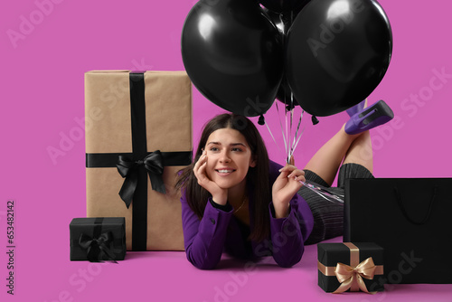 Young woman with gifts and ...