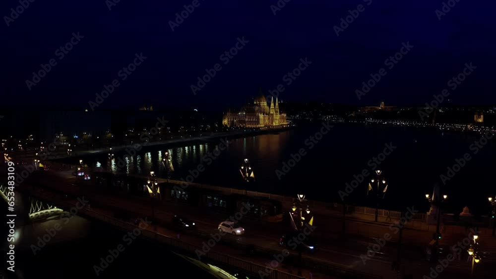 Aerial wide view of Danube river and Budapest city skyline at night time Aerial wide view of Danube river and Budapest city skyline at night time