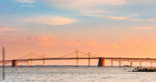 Chesapeake Bay Bridge with blue and orange sunset