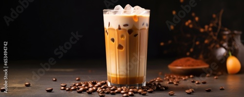 A bold and aromatic combination of freshly brewed coffee and almond milk, serving as a unique take on bubble tea. The beverage is served with chewy pearls made from caramelinfused tapioca, photo