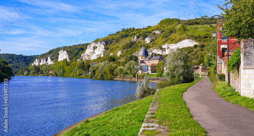 Panoramic view of the banks of the River Seine with the cupola of the old Hospital Saint Jacques in the village of Les Andelys in Normandy, France