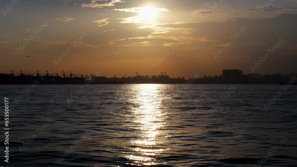 Scenery of Tokyo Bay with the setting sun reflecting off the surface of the sea. Scenery of Tokyo Bay with the setting sun reflecting off the surface of the sea.