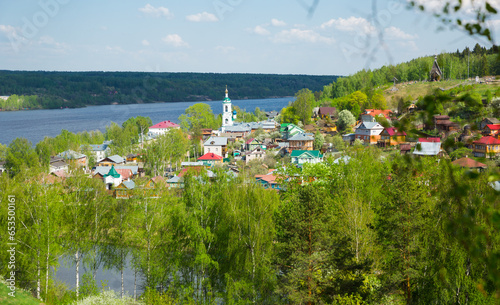 Scenic view of small and picturesque town of Plyos on bank of Shokhonka river in springtime, Russia
