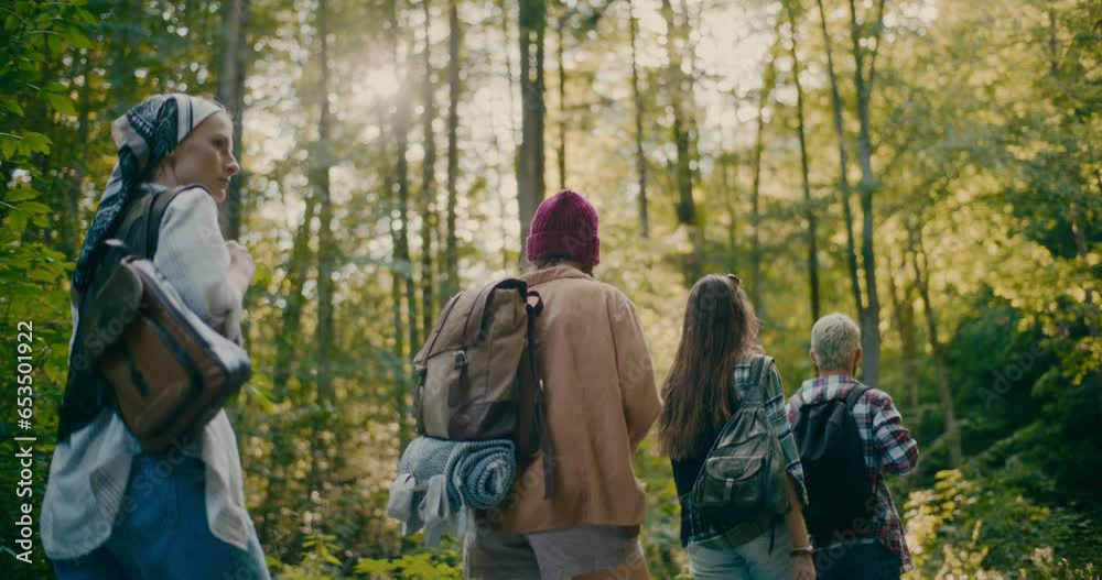 Tourists With Backpacks Exploring Forest During Vacation Tourists With Backpacks Exploring Forest During Vacation